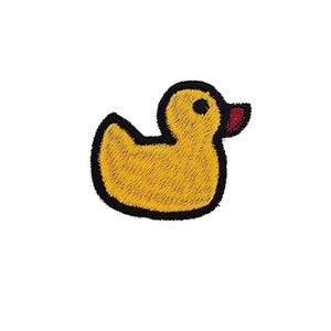 May include: A yellow rubber duck with a black outline and a red beak. The duck is a simple cartoon design.