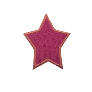 May include: A pink star-shaped patch with an orange outline. The patch is made of a soft, fuzzy material.