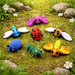 May include: A collection of colorful clay insects, including a ladybug, bee, dragonfly, and caterpillar, are arranged on a bed of green moss. The insects are in various colors, such as red, blue, and yellow, with white accents.