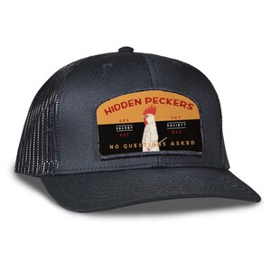 May include: A black trucker hat with a mesh back and a curved brim. The front patch features the text "HIDDEN PECKERS" above an illustration of a rooster. Below the rooster is the text "NO QUESTIONS ASKED".