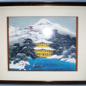 Japanese woodblock of yellow pagoda , Mt Fuji in background Signed, Frame measures 15 x 12 inches