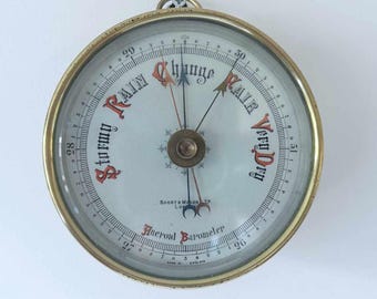 Barómetro aneroide de ajuste de altitud con patente C y T, fabricado por Short & Mason London.