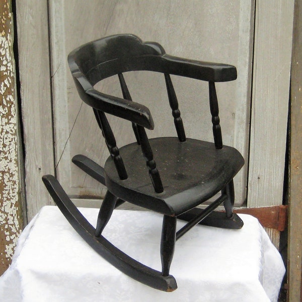 Antique black wood childs toddlers rocker, rustic small rocking chair, solid thick wood, curved wrap around back, 20s 30s, early 1900s