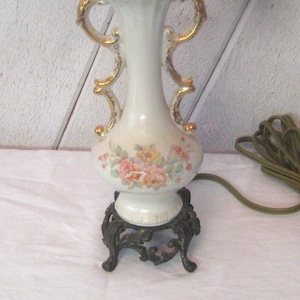 Antique petite table lamp, curvy ornate hour glass lamp, ceramic ivory beige with cast iron base, floral design small table lamp early 1900s