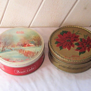 Christmas cookie tin, round metal box, Winter snow country scene, red pointsettias, Shirley Jones Fruit cake box, mid century, 1950s