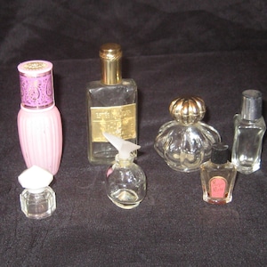 Collection of 7 tiny glass perfume bottles, pink purple glass Avon Somewhere, Elusive Roll on, Estee Lauder Youth Dew, Magic Rose, Pique