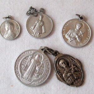 Collection of 5 silver Saint medals, antique religious charms, Madonna, St. Gerard, Infant if Prague, St. Martin de Porres, Latin Italian