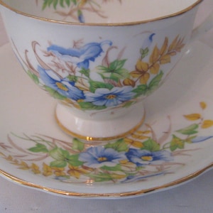 Vintage tea cup, blue morning glories, Clarence fine bone china, English teacup, blue floral, green yellow leaves, gold trim, mid century