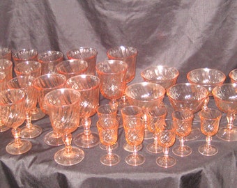 Vintage set of pink stemmed wine glasses, swirled design, margarita glasses, pedestal shot glasses, 1970s, large collection