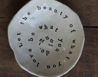 Inspirational Rumi quote ring dish "Let the beauty of what you love be what you do". Handmade white stoneware.