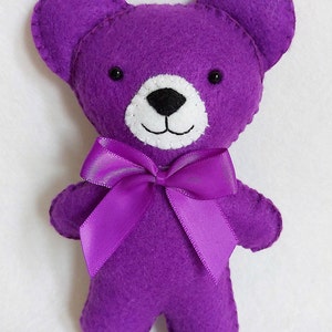 Purple felt teddy bear.