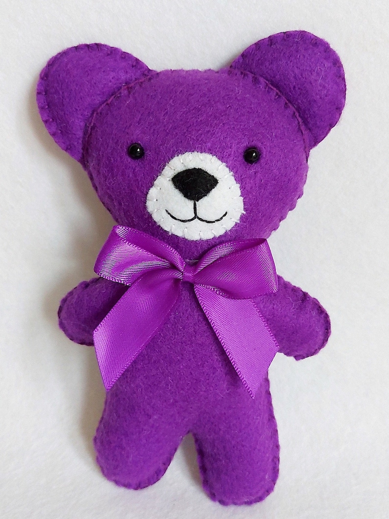 Purple felt teddy bear.