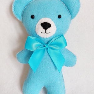 Blue felt teddy bear.