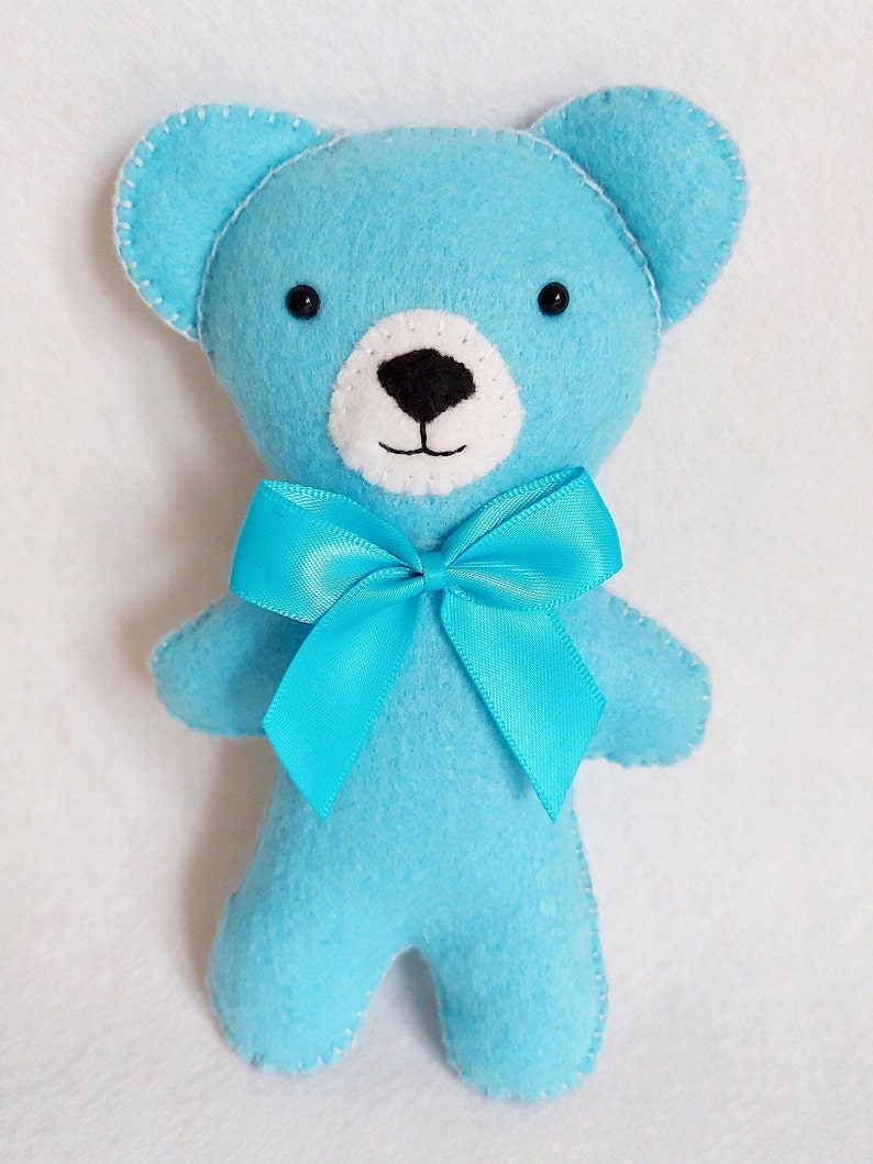 Blue felt teddy bear.