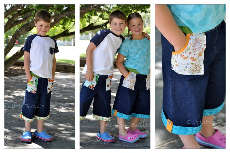 May include: Two children wearing denim shorts with colorful fabric trim and pockets. The boy is wearing a white and blue striped shirt and the girl is wearing a light blue shirt. Both children are smiling.
