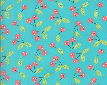 May include: A turquoise fabric with a repeating pattern of red cherries with white dots and green leaves.