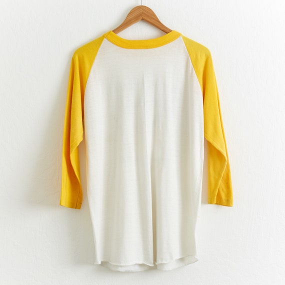 yellow and white baseball tee