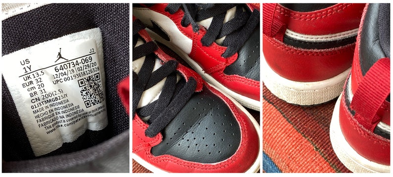 May include: Red and black children's sneakers with white accents. The size tag reads US 1Y, UK 13.5, EUR 32, cm 20, BR 31, CN 200(2.5), 640734-069, 12/04/19 02/29/20, UPC 00193658126326, 0113T3MGB25, MADE IN INDONESIA, HECHO EN INDONESIA, FABRIQUE EN INDONESIE, FARIFICADO NA INDONESIA, www.