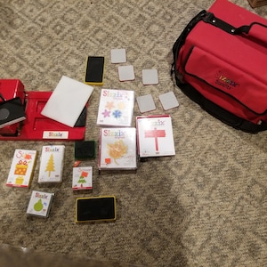 Sizzix machine with 15 dies, case, and adapter