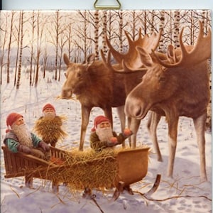 May include: A winter scene featuring three gnomes in red hats and white beards riding a wooden sled filled with hay, pulled by three brown moose. The background shows a snowy forest with bare trees.