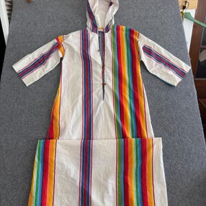 May include: A set of three ceramic mugs with a speckled, matte finish. The mugs are in shades of cream, light gray, and dark gray. Each mug has a simple, minimalist design, perfect for coffee or tea.