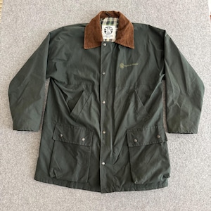 May include: Dark green jacket with a brown corduroy collar and a plaid lining. The jacket has two large front pockets and two smaller chest pockets. The jacket has a button-up front and a logo on the chest.