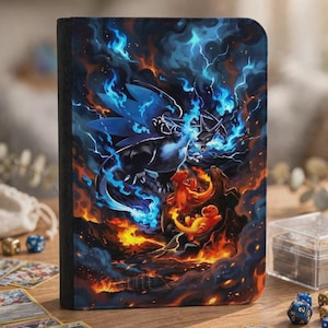 May include: A rectangular trading card binder featuring a vibrant illustration of a large dark dragon surrounded by blue flames and lightning, with smaller orange dragon-like creatures below, all set against a dark, smoky, and fiery background.