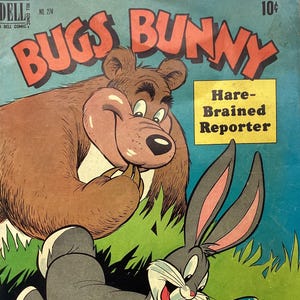 May include: Vintage Bugs Bunny comic book cover. The title "BUGS BUNNY" is in large red letters. Bugs Bunny is depicted with a magnifying glass and pencil, with a bear in the background. The comic is labeled "Hare-Brained Reporter".