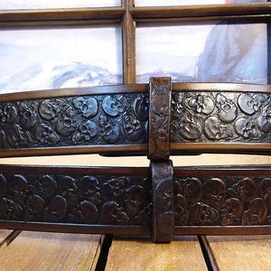 Skulls Embossed in Medium Brown Antique Finish