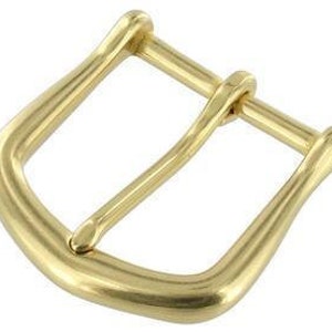 May include: A gold-toned metal buckle with a smooth, rounded finish. The buckle has a classic design with a simple, elegant shape.