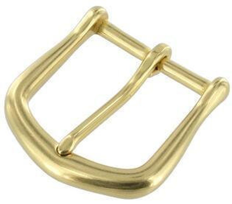May include: A gold-toned metal buckle with a smooth, rounded finish. The buckle has a classic design with a simple, elegant shape.