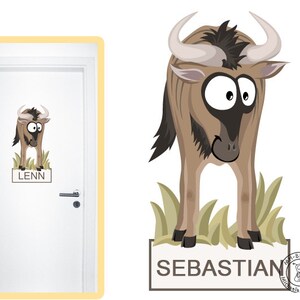 May include: A cartoon wildebeest illustration with large eyes and curved horns, standing in front of green grass. The name "Sebastian" is displayed on a rectangular sign below the animal. A similar image is on a door with the name "Lenn".