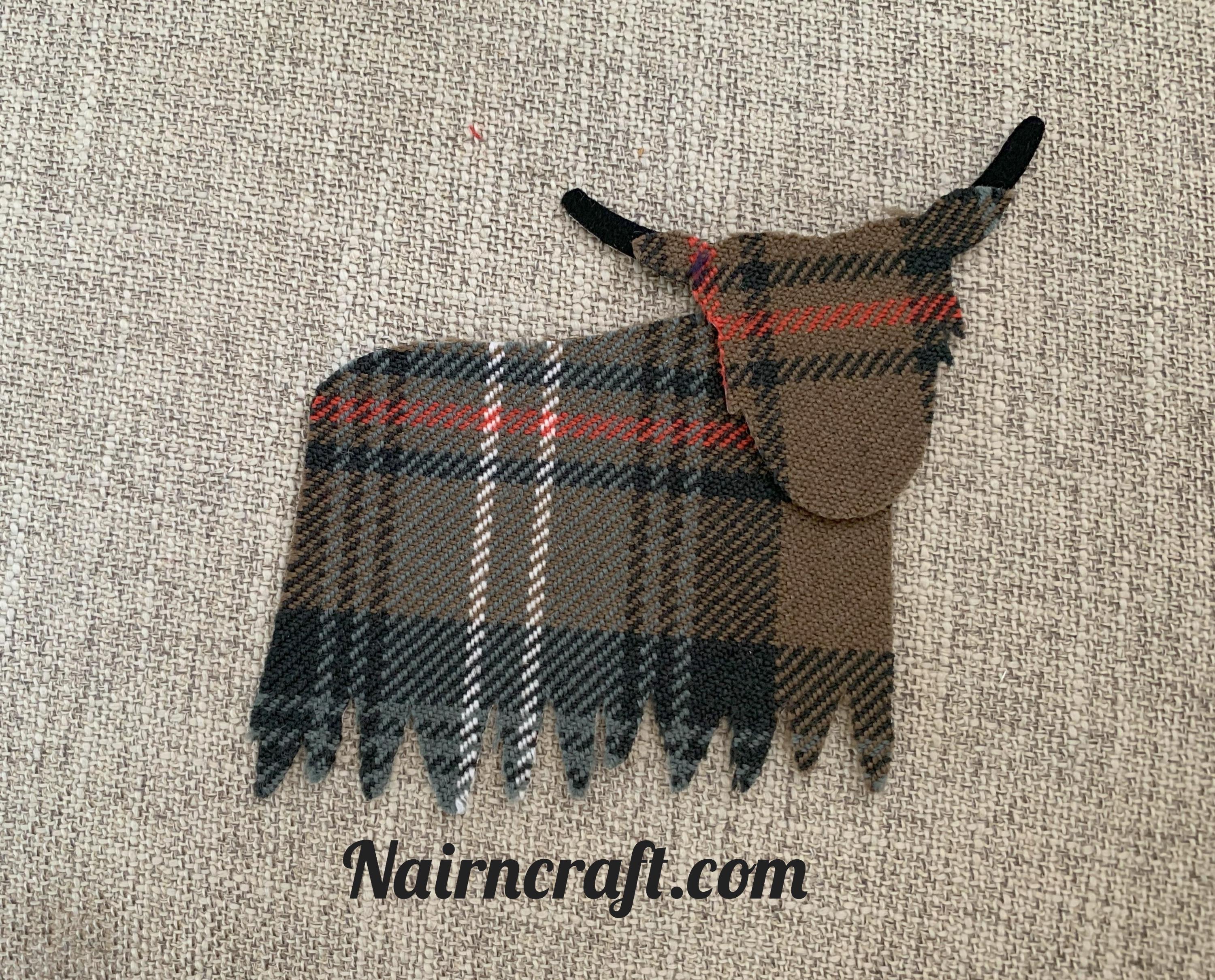 Highland Coo cow Applique Patch In Brown Tartan Cotton Fabric Are Cut highland-coo-cow-applique-patch-in-brown-tartan-cotton-fabric-are-cut