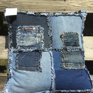 Denim throw pillow sham with pillow form included. Pieced front and cool small pockets, make this an interesting addition denim decor area.B