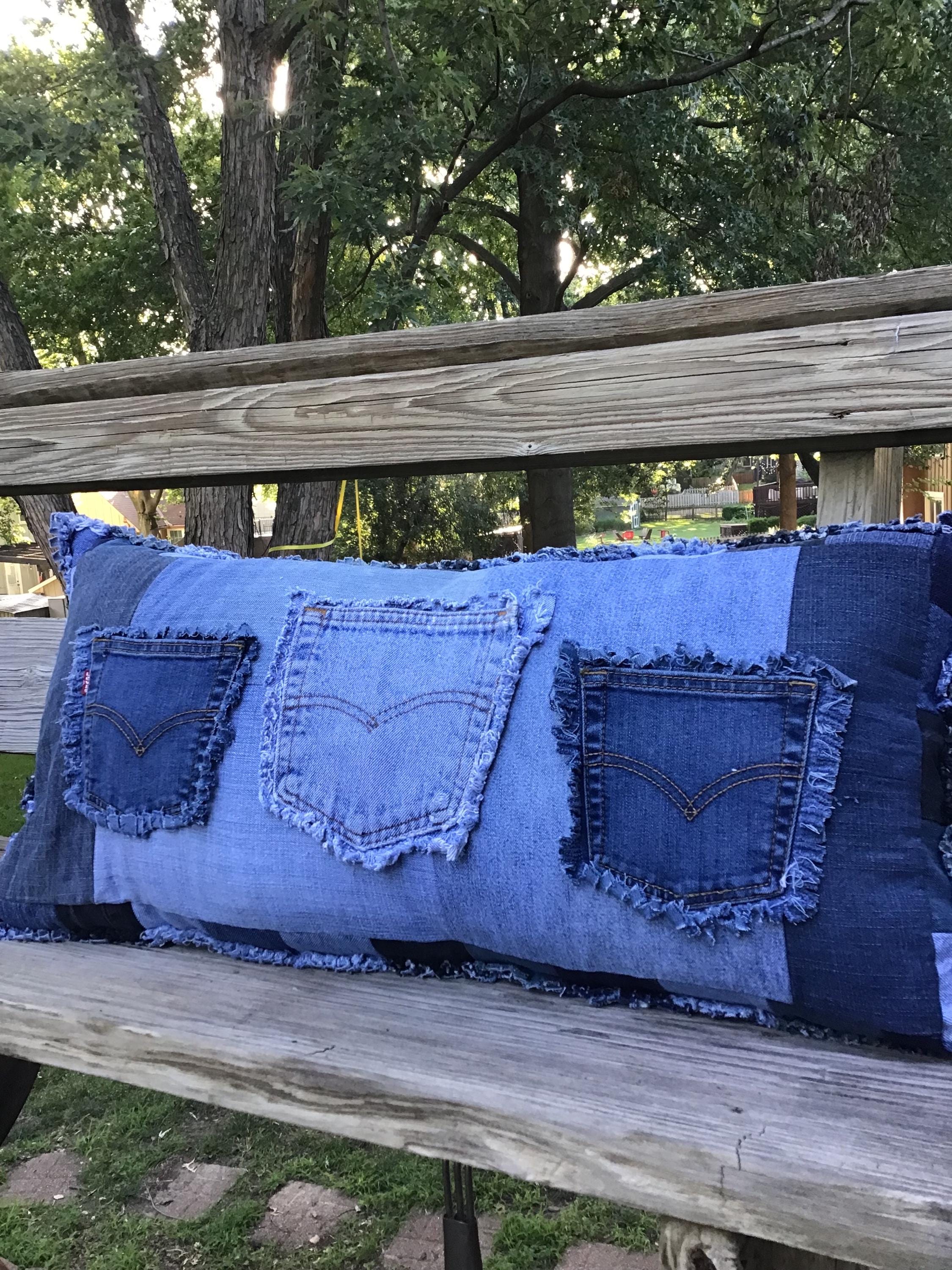 Denim, sham style toss pillow with form included. Big size, with 3 Levi’s brand pockets sewn on a patchwork edge background. Looks great!