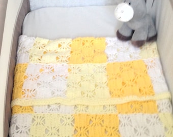 Yellow and white granny square with border baby's cot blanket