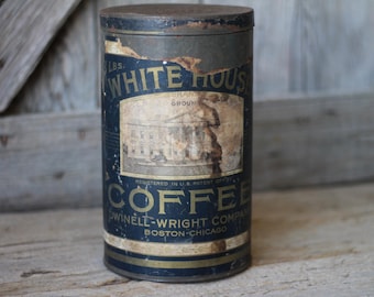 May include: Vintage White House Coffee tin with a dark blue and gold label. The label features an illustration of a building and the text "WHITE HOUSE COFFEE" and "DWINELL-WRIGHT COMPANY BOSTON-CHICAGO".