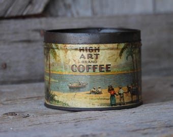 May include: A vintage coffee tin with a tropical scene. The tin has a brown rim and the words "HIGH ART BRAND COFFEE". The illustration shows a beach with palm trees, a boat, and people. The tin is aged and shows signs of wear.