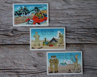 May include: Three vintage postcards with humorous illustrations and text. The first postcard shows a cartoon of a military jeep with soldiers. The second postcard shows a cartoon of a soldier with a suitcase and the text "Sure I can get all my bags in sarge, but where am I gonna sleep?" The third postcard shows a cartoon of a soldier with a suitcase and the text "Should we tell his wife he just had twins?"