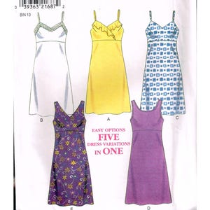 May include: A New Look 6755 sewing pattern envelope featuring five dress variations. The white envelope displays illustrations of dresses in white, yellow, blue and white geometric print, purple floral print, and solid purple, with the text EASY OPTIONS FIVE DRESS VARIATIONS IN ONE.