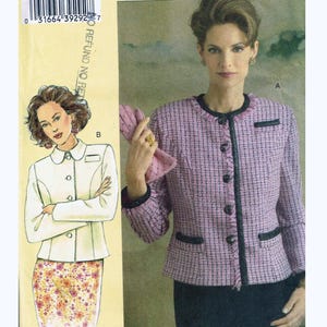 May include: A sewing pattern for a jacket and skirt, featuring a woman wearing a pink tweed jacket with black trim and buttons. The pattern is labeled "V8043" and includes the text "TODAY'S FIT BY SANDRA BETZINA".