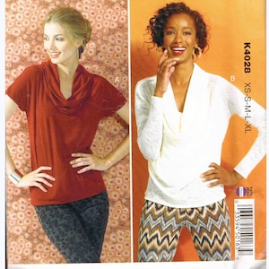 May include: A sewing pattern package labeled "Kwik Sew K4028" featuring two women modeling cowl-neck tops. The package has a white background with red text and a floral pattern. The sizes available are XS-S-M-L-XL.