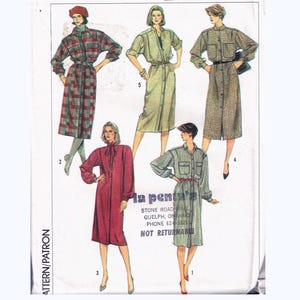 May include: Simplicity pattern 6986 showing dress designs. The pattern includes several dress styles with long sleeves, button-up fronts, and belted waists. The dresses are displayed in various colours and patterns, including plaid and solid colours.