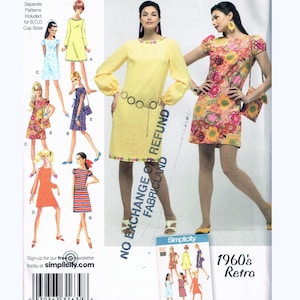 May include: Simplicity sewing pattern 2967, featuring retro 1960s dress designs. The pattern includes multiple dress styles, with options for different cup sizes. The cover showcases models wearing the dresses, with the Simplicity logo prominently displayed.