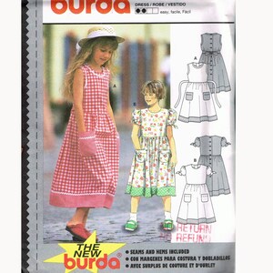 May include: Burda sewing pattern number 3037 for a dress. The pattern includes instructions for making a dress with a gingham print, a floral print, and a solid color. The pattern is for sizes 6-11, which corresponds to European sizes 116-146.