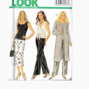 May include: A New Look sewing pattern envelope with illustrations of women's outfits. The designs include a black top and floral skirt, a wrap top and black trousers, and a long grey coat with matching trousers. The envelope has the text "NEW LOOK" and size information.