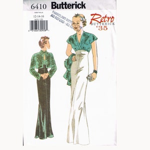 Peut inclure: Un patron de couture vintage pour une robe et une veste. Le patron est de Butterick et est intitulé "Rétro '35". La robe est une longue robe fluide avec un corsage ajusté et une jupe ample. La veste est un style boléro court avec un col montant. Le patron est imprimé sur du papier blanc avec des illustrations noires et vertes.