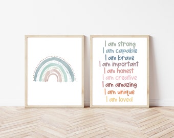 May include: Two framed art prints. One features a watercolor rainbow in shades of blue, green, and brown. The other print displays the words "I am strong, capable, brave, important, honest, creative, amazing, unique, loved" in colorful text.