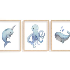 Juego de láminas de acuarela de criaturas marinas: ballena, pulpo, narval.