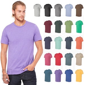 Puede incluir: Una variedad de camisetas lisas en diferentes colores, incluyendo gris jaspeado, negro, azul claro, marr&oacute;n, granate, verde oscuro, turquesa, azul marino, verde menta, naranja, rojo y amarillo. Las camisetas son todas de manga corta y tienen cuello redondo.